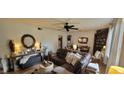 Spacious living room featuring a large brown leather couch and stylish decor at 3039 28Th St, Columbus, IN 47203