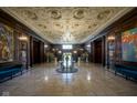 Luxurious lobby showcasing a grand chandelier, marble floors, and classic architectural details at 350 N Meridian St # 505, Indianapolis, IN 46204