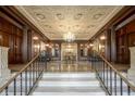 Ornate lobby with coffered ceilings, chandelier, marble floors, and decorative columns at 350 N Meridian St # 505, Indianapolis, IN 46204