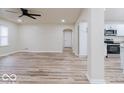 Spacious living room with lots of natural light, modern flooring, and an open concept to the kitchen at 3558 N Gladstone Ave, Indianapolis, IN 46218