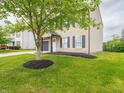Two story home with well maintained lawn and mulch, showcasing charm and curb appeal at 3734 Lacebark Dr, Indianapolis, IN 46235