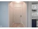 Open hallway showcasing marble flooring and entryway into the kitchen at 400 E 34Th St, Anderson, IN 46013