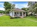 Inviting single-story home with a well-manicured lawn and classic architectural details at 4641 Crittenden Ave, Indianapolis, IN 46205