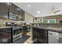 Well-appointed kitchen featuring stainless steel appliances, granite countertops and ample cabinet space at 4736 Blue Marlin Way, Indianapolis, IN 46239