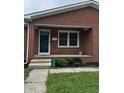 Close up of the front door and porch on a red brick house at 719 Henry St, Lebanon, IN 46052