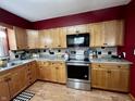 Kitchen featuring stainless steel appliances and wood cabinets at 719 Henry St, Lebanon, IN 46052