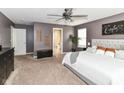 Cozy bedroom with neutral carpet, ceiling fan, ample natural light, and a stylish decor at 7214 Morello Ln, Noblesville, IN 46062