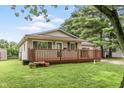 Charming home with a spacious deck, perfect for outdoor relaxation and entertaining at 724 Alexander St, Greenwood, IN 46143