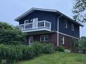 Charming exterior view of this home featuring a second story deck area at 75 Byram Blvd, Martinsville, IN 46151