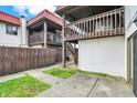 Backyard featuring a wooden privacy fence, landscaping, and multi-level balconies at 8545 La Corrida Ct, Indianapolis, IN 46227