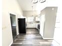 Functional kitchen with white cabinets, stainless steel appliances, and a window over the sink at 10922 Snowdrop Way, Indianapolis, IN 46235