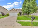 Charming single-story home with a well-manicured lawn and attached two car garage at 11254 N Sashing Way, Monrovia, IN 46157