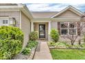 Inviting front exterior featuring manicured bushes and fresh landscaping at 11254 N Sashing Way, Monrovia, IN 46157