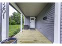 Spacious front porch featuring a wooden deck, stylish columns, and a welcoming entrance at 1201 Villa Ave, Indianapolis, IN 46203