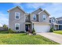 Charming two-story home featuring a two-car garage and well-maintained lawn at 1375 Crabapple Rd, Franklin, IN 46131