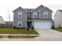 Charming two-story home with a well-maintained lawn and attached two car garage at 1375 Crabapple Rd, Franklin, IN 46131