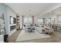 Spacious living room featuring neutral tones, fireplace, and bright natural light at 16465 Mount Logan Rd, Noblesville, IN 46060