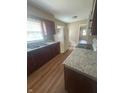 Functional kitchen featuring laminate countertops, a double sink, and essential appliances at 2180 N Irwin St, Indianapolis, IN 46219