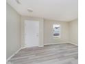 Bright living room featuring neutral paint and wood-look flooring at 2834 Wolfgang Dr, Indianapolis, IN 46239