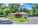 Attractive single-story stone home with landscaped yard, mature trees and three car garage at 3528 E 116Th St, Carmel, IN 46033