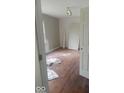 Bright bedroom with hardwood floors ready for your design touches at 3626 N Denny St, Indianapolis, IN 46218