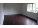 Bright bedroom with hardwood floors and a large window at 5 Tousley Ct, Indianapolis, IN 46224
