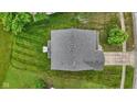 Aerial view of a well maintained house with nice roof and a big yard at 5637 Woodland Trace Blvd, Indianapolis, IN 46237