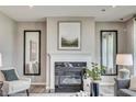Close-up of a modern fireplace with decorative mirrors and mantel at 587 Bluestem Ln, New Whiteland, IN 46184