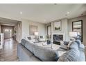 Bright living room featuring a cozy fireplace, modern decor and stylish furniture at 587 Bluestem Ln, New Whiteland, IN 46184