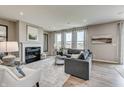 Comfortable living room with fireplace, plush seating, and abundant natural light at 587 Bluestem Ln, New Whiteland, IN 46184