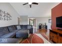 Spacious living room featuring a cozy couch, hardwood floors, and a neutral color scheme at 5967 Peregrine Blvd, Indianapolis, IN 46228