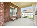 Relaxing covered front porch with views of the surrounding neighborhood at 7082 Hunters Ridge Dr, Plainfield, IN 46168