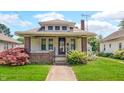 Charming bungalow-style home with brick accents, landscaped yard, and a cozy front porch at 753 Walnut St, Franklin, IN 46131