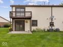 A beautiful outdoor backyard view with a second story deck at 1205 Cypress Dr, Shelbyville, IN 46176