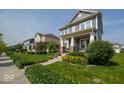 A street view showcasing the well-maintained lawns and inviting exteriors of the neighborhood homes at 12976 Walbeck Dr, Fishers, IN 46037