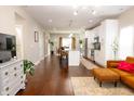 Spacious open-concept living area with hardwood floors flowing into a modern kitchen at 2014 W Michigan St, Indianapolis, IN 46222