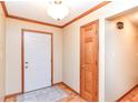 Inviting entryway with neutral walls, wood trim, and stylish tile accents at 206 Banbury Rd, Noblesville, IN 46062