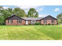 Lovely brick home featuring a lush front lawn and a welcoming entrance at 206 Banbury Rd, Noblesville, IN 46062
