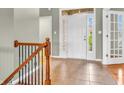 Welcoming foyer features tile floors, decorative railings, and a glass door to the left at 2948 Chalbury Dr, Plainfield, IN 46168