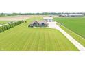 Expansive aerial view of a beautiful home with a long driveway, and a large lawn at 3301 N 200 W, Franklin, IN 46131