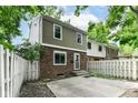 The backyard features a large concrete patio, a privacy fence, and a green lawn space at 392 Aspen Dr, Carmel, IN 46032