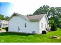 Back exterior view of home featuring a well-maintained lawn and siding at 4305 W Coyote Run Ct, Muncie, IN 47304