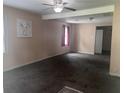Spacious living room with neutral walls and a ceiling fan at 4521 Vernon Ave, Indianapolis, IN 46226
