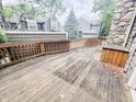 Outdoor deck with wood railings offering views of the community and surrounding trees at 4635 Stansbury Ct, Indianapolis, IN 46254