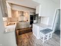 Well-lit kitchen with stainless steel appliances, granite countertops, and a breakfast bar at 4635 Stansbury Ct, Indianapolis, IN 46254