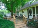 Backyard deck featuring bench seating and a view of the lush greenery, creating a serene outdoor experience at 4747 Guion Rd, Indianapolis, IN 46254