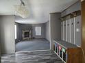 Inviting living room with a stone fireplace and wood-look floors at 496 Tague St, Greenfield, IN 46140