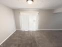 Bright living room with neutral carpet and sliding glass door at 5826 Buck Rill Dr, Indianapolis, IN 46237