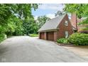 Spacious three-car garage with ample parking and brick detailing at 6220 E 56Th St, Indianapolis, IN 46226