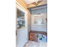 Inviting entryway features a built-in bench and rustic decor at 6837 Littleton Dr, Indianapolis, IN 46221
